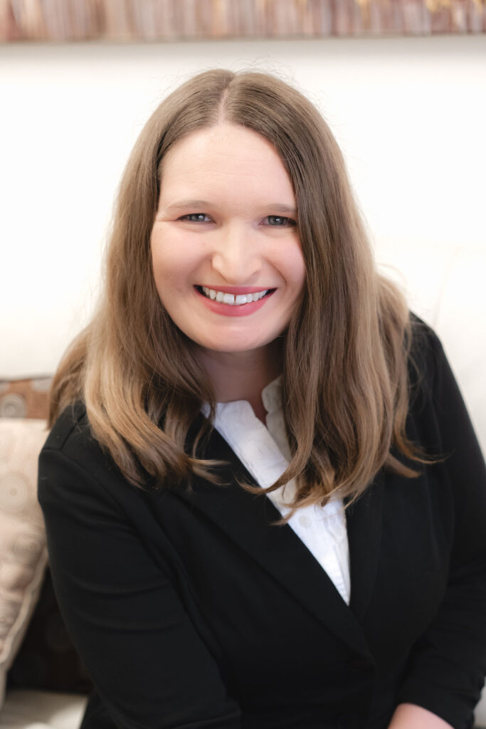 Elizabeth O’Malley, LMFT, smiling in a professional setting at The Light Center in South Bay. Specializes in therapy for individuals, couples, and families navigating emotional and relational challenges.
